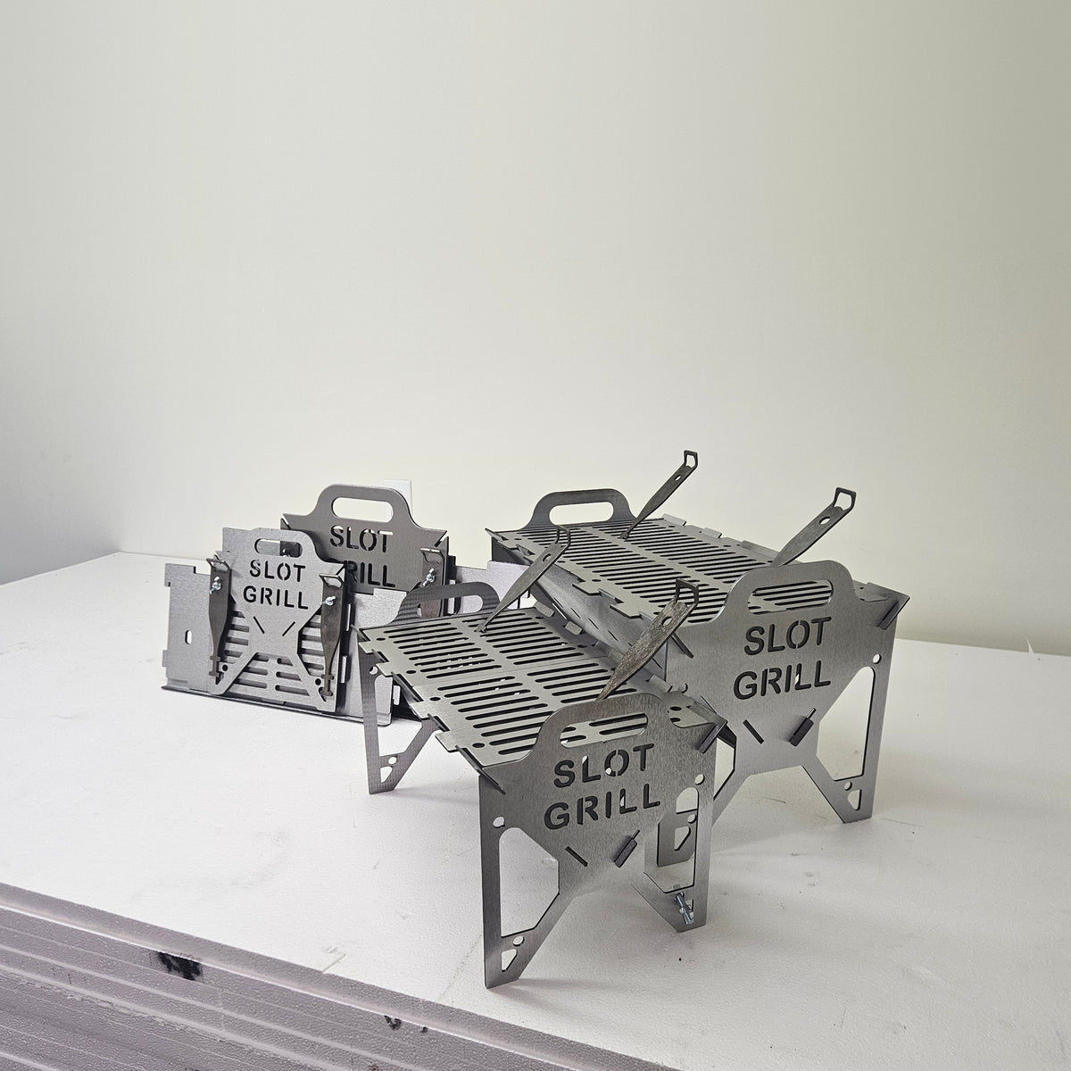 Slot Grill Full Size and Compact assembled, with their flat-packed panels