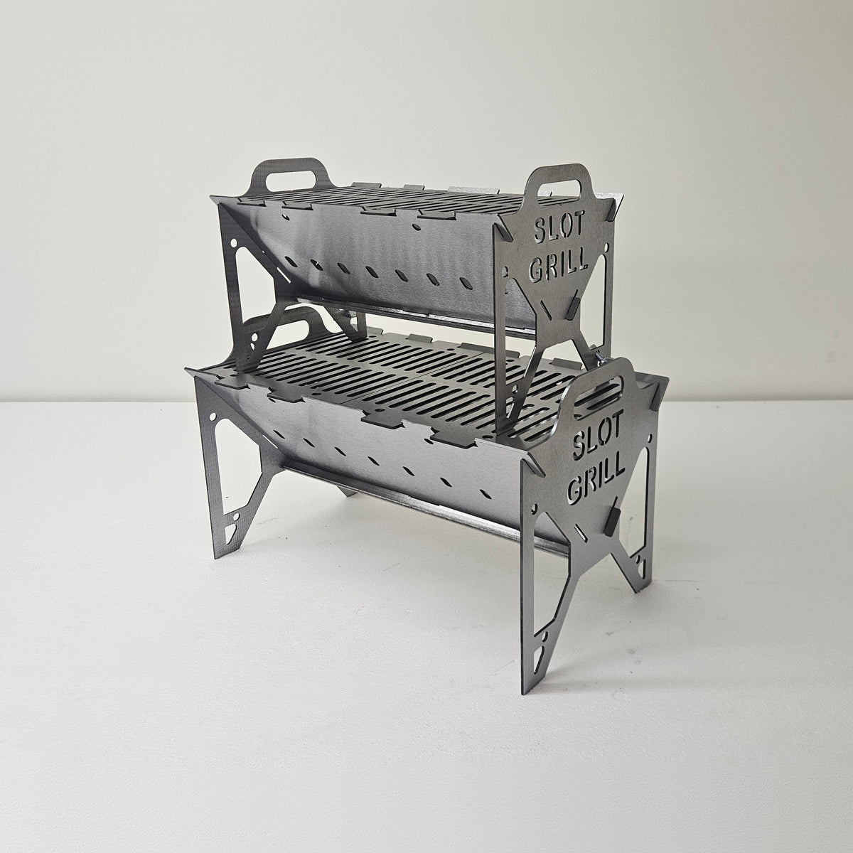 Slot Grill Full Size and Compact stacked, both with slotted grill grates