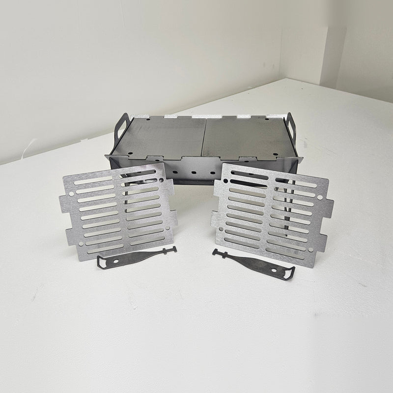 Slot Grill Compact with two solid griddle plates on top and two slotted grates in front