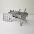 Slot Grill Full Size with a solid griddle plate on one half and a slotted grate on the other, spare grate beside it